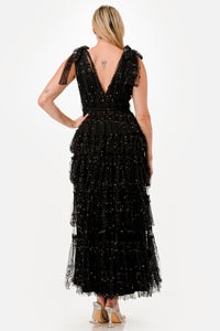 Vestido maxi negro con perlas doradas