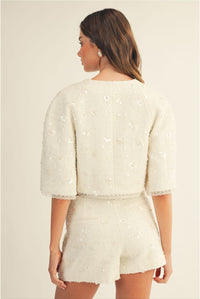 Set blanco tweed con lentejuelas y shorts